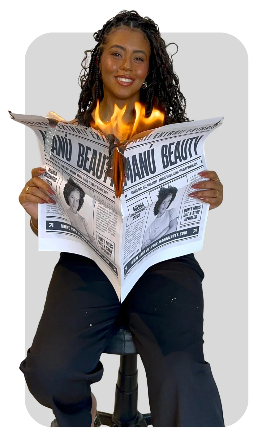 Manú segurando jornal Manú Beauty em chamas